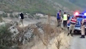 Baraj gölüne uçan araçtan sağ kurtarıldılar 