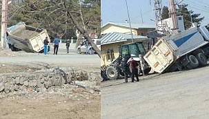 Toprağa saplanan kamyon yan yattı 