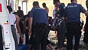 Sokak ortasında eşini bıçakla yaralı 