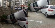 Otomobil istinat duvarından başka aracın üstüne uçtu